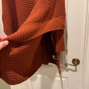Batwing sweater. Did not come with tags. Not my style. Rust color. Over-sized.